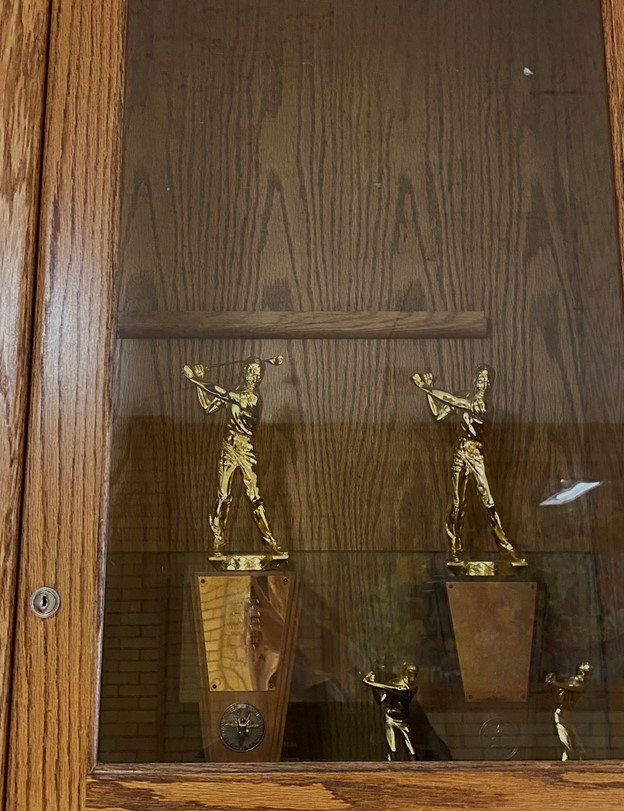 This is a picture of the Kearns high school golf trophies, The team hopes to add another one. 